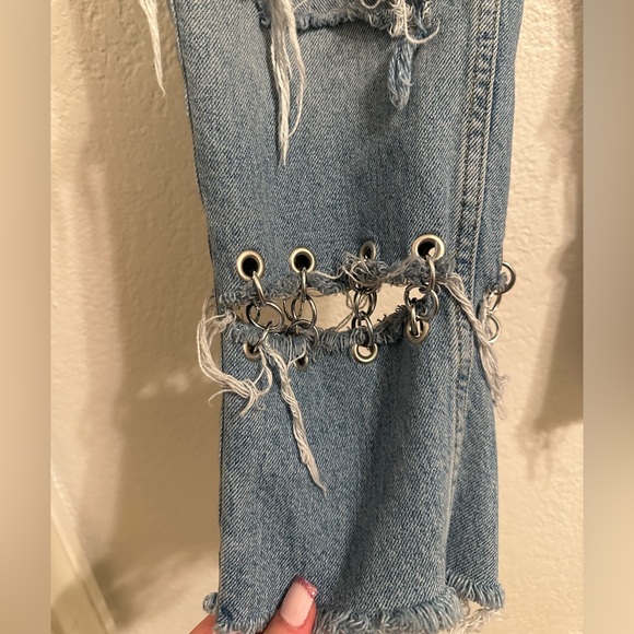 Jeans are cropped at the ankle and wide in the waist. - Picture 5 of 9